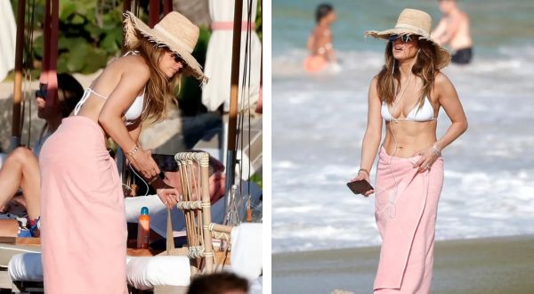 Basking in the Sun: Jennifer Lopez flaunts toned abs in stylish white bikini while strolling on St. Barts Beach